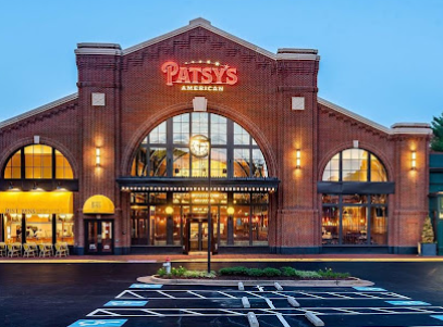 Front of a brick restaurant with red sign saying Patsy's